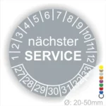 Kontrollplakette Service, Prüfetiketten rund, Farbe- Grau, Text "nächster SERVICE" in weiß. Startjahr- 27, Monatszahlen Oben und Jahreszahlen Unten in Kreisform.