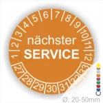 Prüfaufkleber, Prüfetiketten rund, Farbe- Orange, Text "nächster SERVICE" in weiß. Startjahr- 27, Monatszahlen Oben und Jahreszahlen Unten in Kreisform.