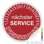 Prüfaufkleber, Prüfetiketten rund, Farbe- Rot, Text "nächster SERVICE" in weiß. Startjahr- 27, Monatszahlen Oben und Jahreszahlen Unten in Kreisform.