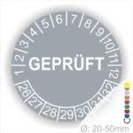 Rundschild mit der Aufschrift "GEPRÜFT" und Zahlen von 1 bis 32, geeignet für Durchmesser von 20-50 mm, in grauer Farbe.