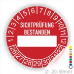 Prüfplakette, Prüfsiegelrund, Farbe- Rot, Text "SICHTPRÜFUNG-BESTANDEN" in Weiß. Als nächstes kommt ein Beschriftung Feld / Leer Feld in Farbe Weiß. Startjahr- 26, Monatszahlen Oben und Jahreszahlen Unten in Kreisform.