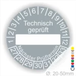 Prüfetiketten rund, Farbe- Grau, Text "Technisch geprüft" in Weiß. Als nächstes kommt ein Beschriftungsfeld / Leer Feld in Farbe Weiß. Startjahr- 27, Monatszahlen Oben und Jahreszahlen Unten in Kreisform. über den Jahreszahlen Text "Nächster Prüftermin"