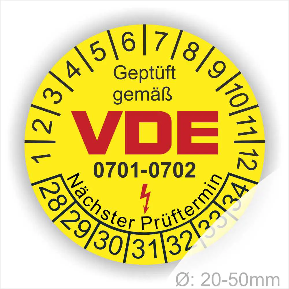 Gelbes Prüfzeichen mit der Aufschrift "Geprüft gemäß VDE" und den Nummern 0701-0702, umgeben von einer Skala für den nächsten Prüftermin. Durchmesser von 20-50 mm.
