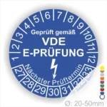 VDE E-Prüfungsaufkleber in Blau, der die Prüfung gemäß VDE-Standards bestätigt, mit Angaben zum nächsten Prüftermin und einem Durchmesser von 20-50 mm.