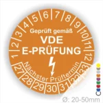 VDE E-Prüfplakette für elektrische Geräte, geprüft gemäß VDE-Norm, mit Angabe des nächsten Prüftermins und Größenbereich von 20-50 mm.